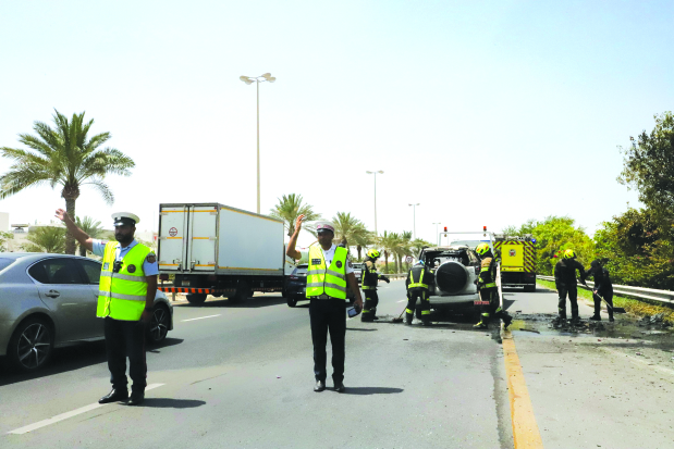 <p>Civil Defence officers yesterday extinguished a fire that broke out in a vehicle following a traffic accident on Shaikh Khalifa Bin Salman Highway towards Manama.</p>
<p>The National Ambulance Service rushed to the scene and provided first aid to the female driver, who reportedly sustained minor injuries.</p>
<p>Above, officers at the scene.</p>